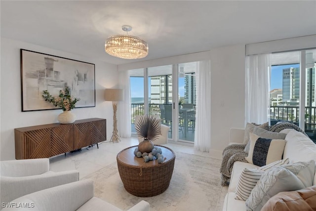 living room featuring a notable chandelier and a healthy amount of sunlight