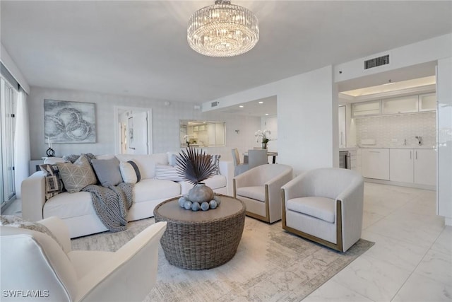 living room featuring a notable chandelier