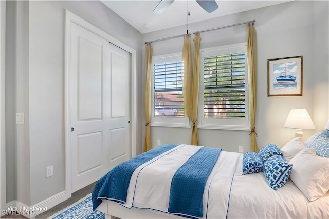 bedroom with a closet, ceiling fan, and carpet floors