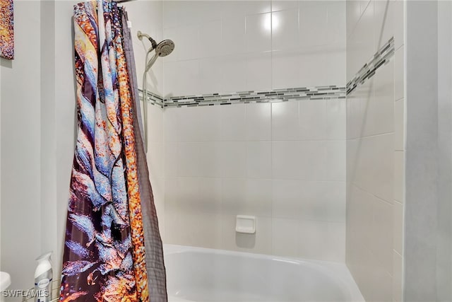 bathroom featuring shower / tub combo with curtain