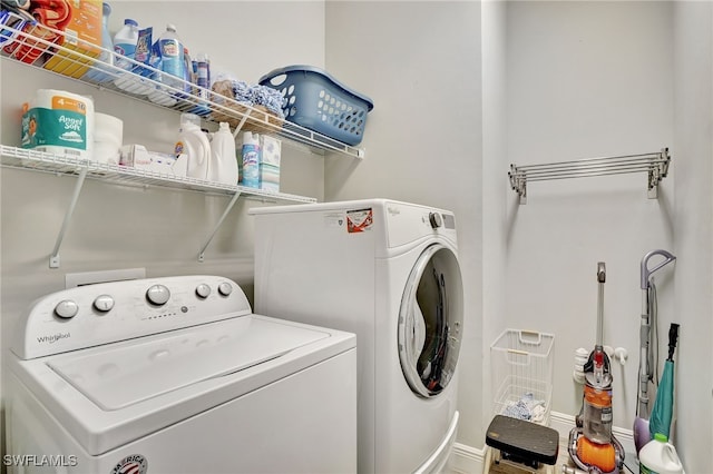 washroom featuring washer and clothes dryer