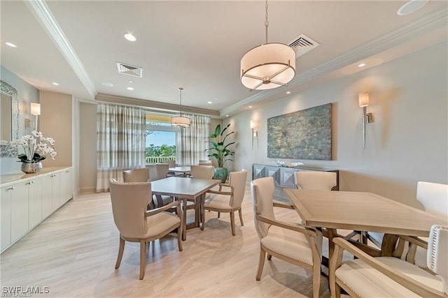 dining space with ornamental molding