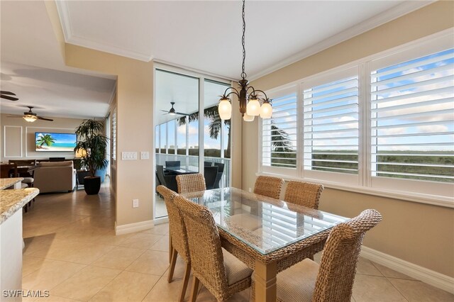 dining room featuring ornamental molding, ceiling fan with notable chandelier, and light tile patterned flooring