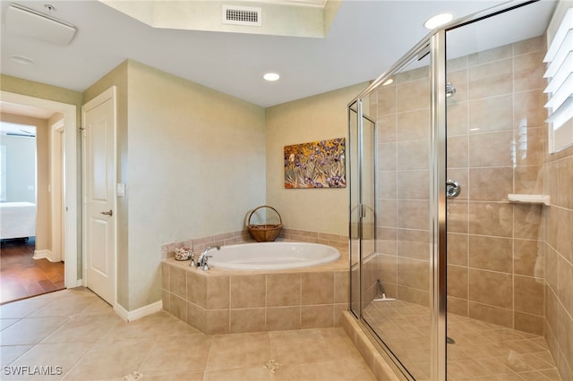 4761 W Bay Blvd Unit 403, Estero, FL 33928 - ensuite bathroom with tile patterned flooring, a shower stall, a garden tub, and recessed lighting