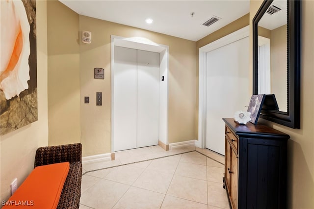 4761 W Bay Blvd Unit 403, Estero, FL 33928 - bathroom featuring elevator, baseboards, recessed lighting, and tile patterned flooring