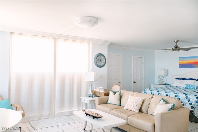 tiled bedroom with crown molding and ceiling fan