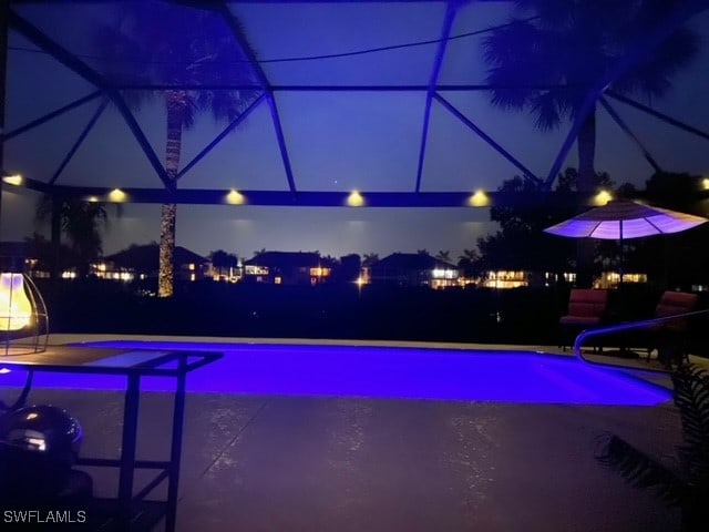 pool at night with a water slide