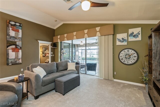 carpeted living room featuring ornamental molding, vaulted ceiling, and ceiling fan