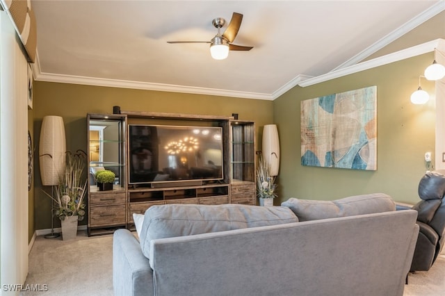 living room with ornamental molding, vaulted ceiling, light colored carpet, and ceiling fan