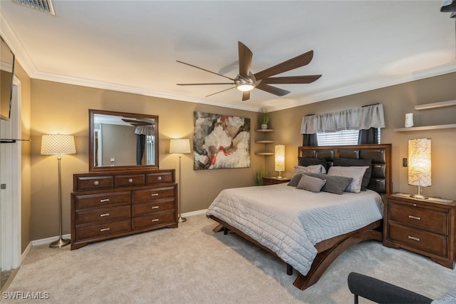 bedroom with crown molding, light colored carpet, and ceiling fan