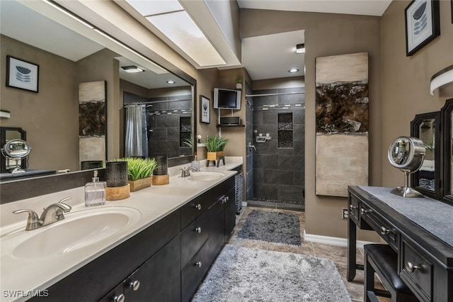 bathroom featuring tile patterned floors, vaulted ceiling, vanity, and curtained shower