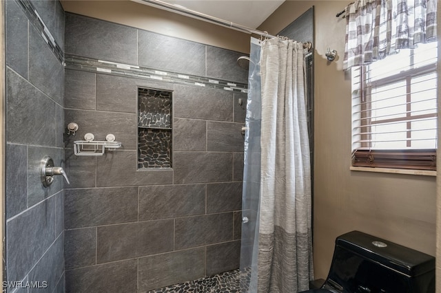 bathroom featuring a shower with curtain