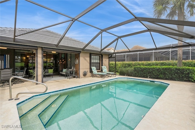 view of pool featuring a patio and a lanai