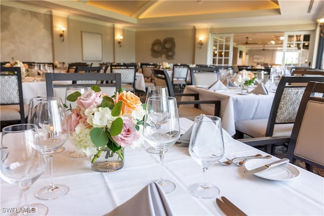 dining room with a raised ceiling