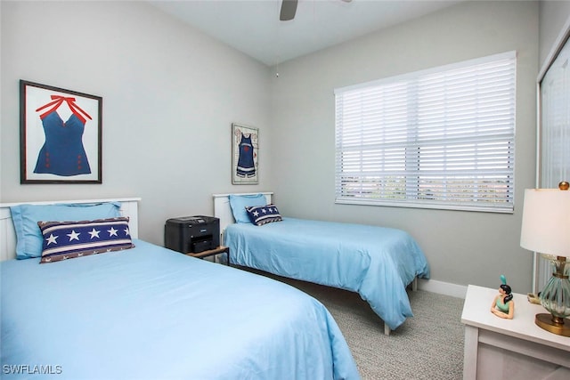 carpeted bedroom with ceiling fan