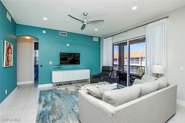 living room with light tile patterned floors and ceiling fan