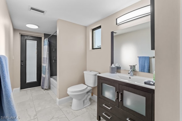 full bathroom featuring shower / bath combo, vanity, and toilet