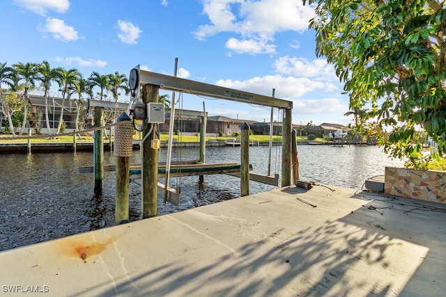 dock area featuring a lanai and a water view