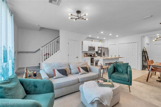 tiled living room featuring an inviting chandelier