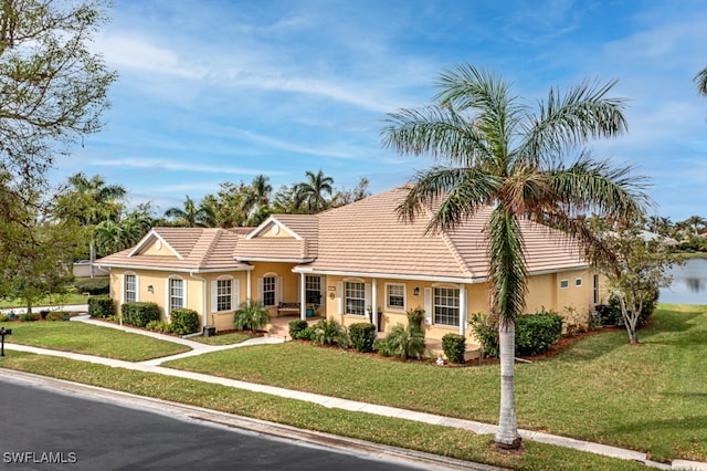 single story home with a front lawn