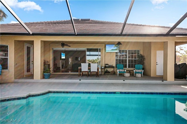 back of house featuring a lanai, a patio area, and ceiling fan