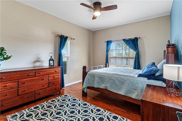 bedroom with hardwood / wood-style flooring and ceiling fan