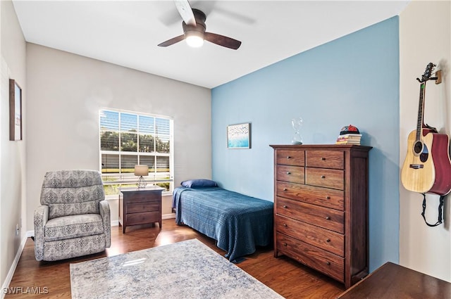 bedroom featuring dark hardwood / wood-style floors and ceiling fan