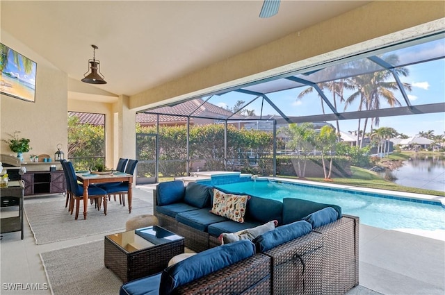 view of patio featuring a lanai, an outdoor hangout area, and a water view