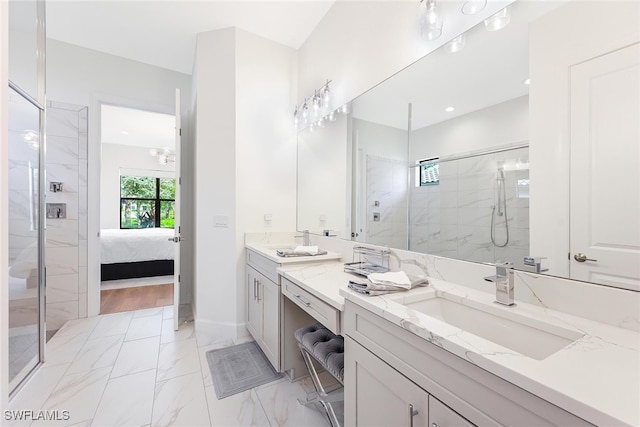 bathroom featuring vanity and an enclosed shower