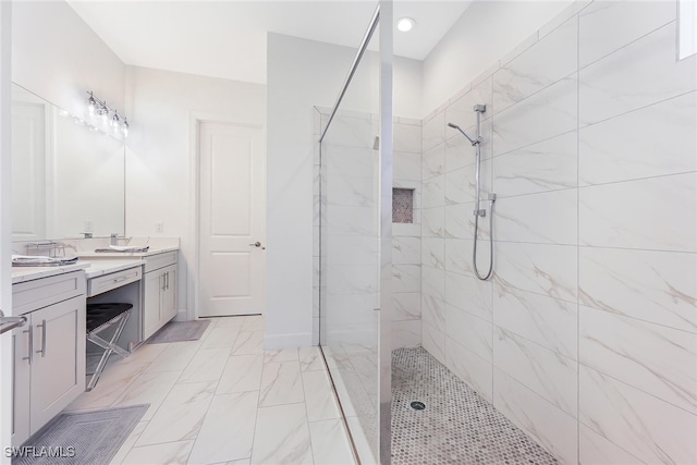 bathroom featuring vanity and a tile shower