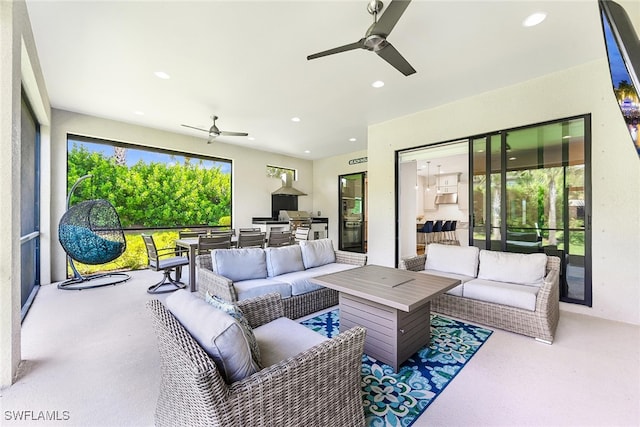 living room featuring ceiling fan and carpet