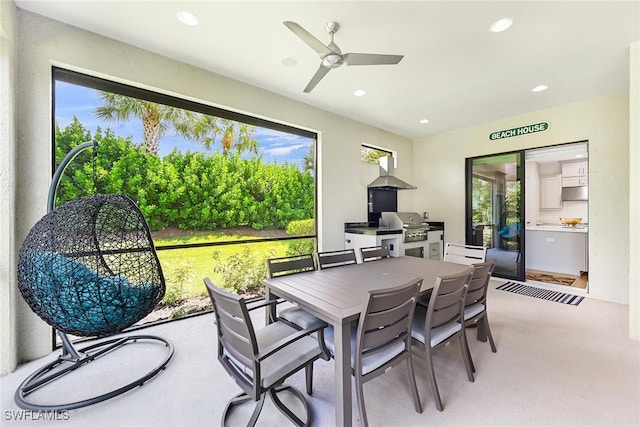 sunroom / solarium featuring ceiling fan