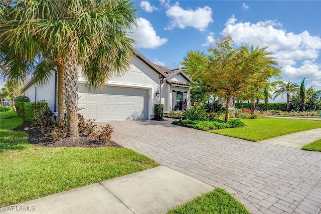 view of front of house featuring a front yard and a garage