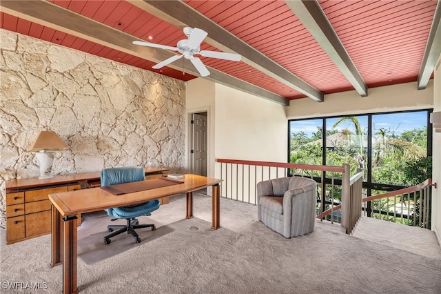 home office with light carpet, beamed ceiling, ceiling fan, and wood ceiling