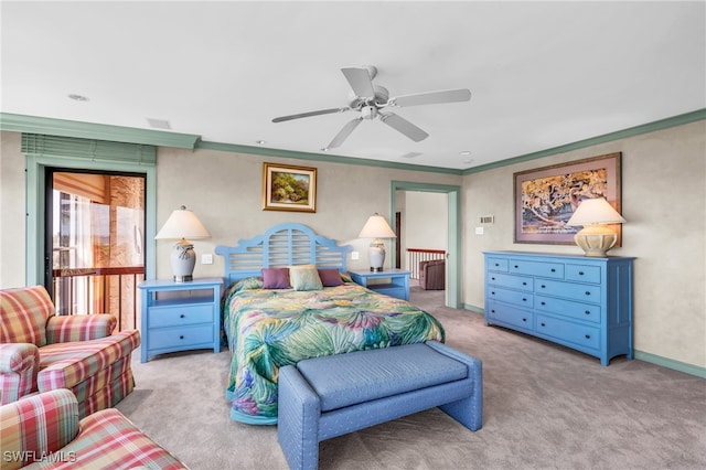 carpeted bedroom featuring ornamental molding and ceiling fan