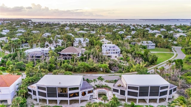 aerial view at dusk with a water view