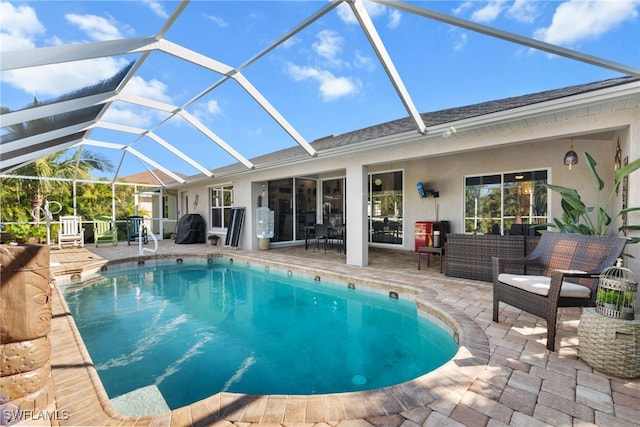 view of pool featuring outdoor lounge area, a lanai, and a patio area