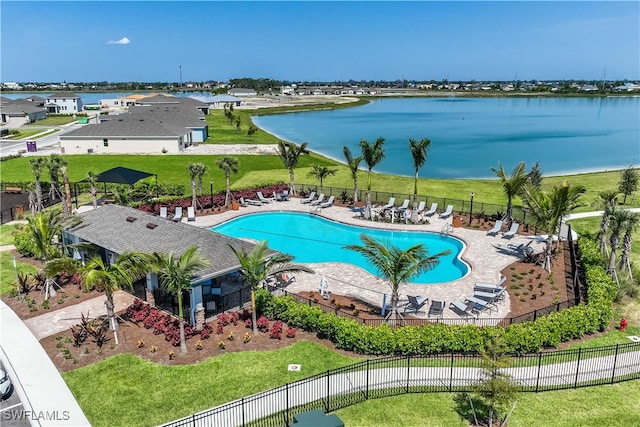 view of pool featuring a patio area and a water view