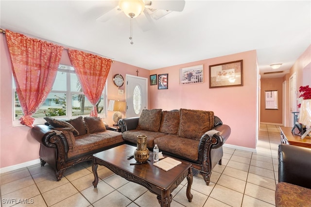 living room with ceiling fan and light tile patterned floors