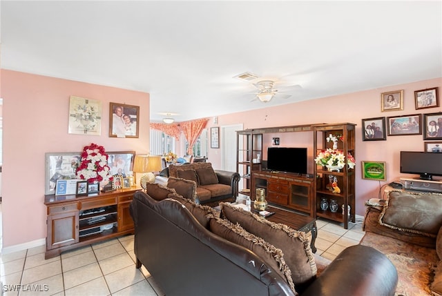 living room featuring light tile patterned floors and ceiling fan