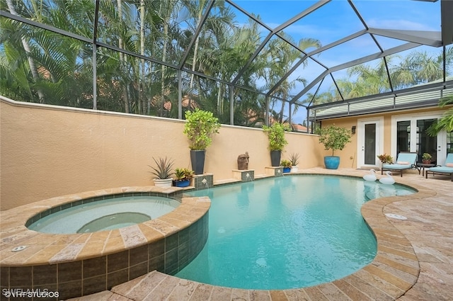 view of swimming pool featuring an in ground hot tub, french doors, glass enclosure, and a patio area