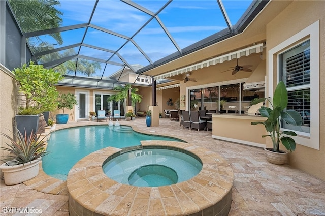 view of swimming pool featuring an in ground hot tub, a patio, and ceiling fan