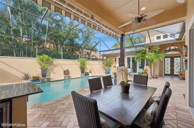 4908 Rustic Oaks Cir, Naples, FL 34105 - outdoor pool with french doors, a ceiling fan, a patio, and a lanai