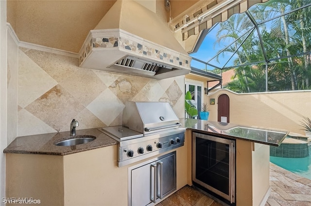 view of patio / terrace with a lanai, area for grilling, and sink