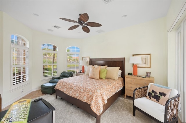 bedroom featuring ceiling fan and light tile patterned floors