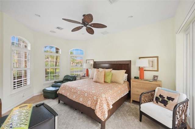4908 Rustic Oaks Cir, Naples, FL 34105 - tiled bedroom featuring a ceiling fan and baseboards
