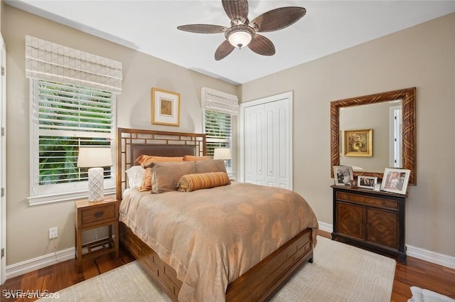 4908 Rustic Oaks Cir, Naples, FL 34105 - bedroom with baseboards, a closet, and multiple windows