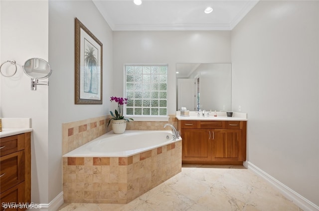 bathroom with a relaxing tiled tub, ornamental molding, and vanity