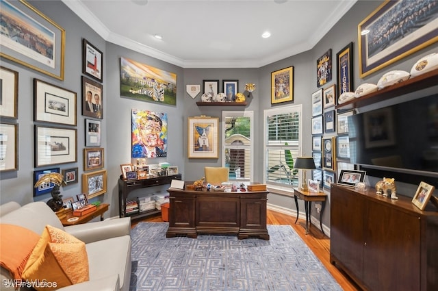 home office with hardwood / wood-style floors and ornamental molding