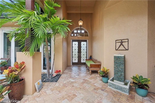 4908 Rustic Oaks Cir, Naples, FL 34105 - doorway to property with stucco siding and french doors